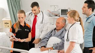 A group of students with a patient