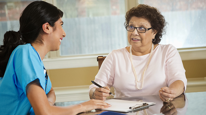 nurse with elderly patient - evidence based healthcare