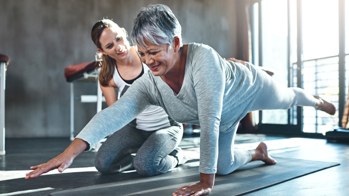 senior woman exercising at the gym