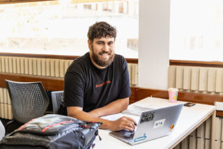 Student sitting at computer in resource centre