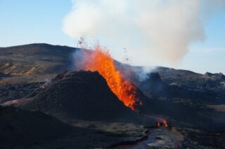 The speed and volume of carbon dioxide emitted from supervolcanoes controlled the severity of past environmental crises on Earth